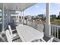 Generous covered balcony perfect for outdoor dining and relaxation with scenic views at 4904 Salt Creek Ct., North Myrtle Beach, SC 29582