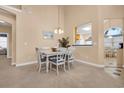 Bright dining area with white table and chairs at 516 5Th Ave. S, North Myrtle Beach, SC 29582