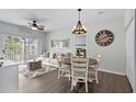 Inviting living area features a sliding glass door that opens to a balcony, modern decor, and ceiling fan at 6208 Sweetwater Blvd. # 6208, Murrells Inlet, SC 29576