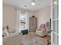 Cozy bedroom with natural light, comfortable seating, and stylish decor at 644 Serendipity Circle, Murrells Inlet, SC 29576