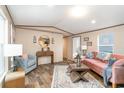 Inviting living room featuring a pink sofa, a gray arm chair and stylish decor at 6461 Norton Rd., Green Sea, SC 29545