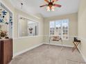 Home office featuring a desk, window with plantation shutters and ceiling fan at 799 Helms Way, Conway, SC 29526