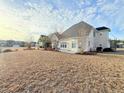 Wide view of backyard of house with bright siding at 8304 Parasol Ct., Myrtle Beach, SC 29579