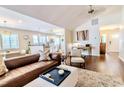 Bright living room with hardwood floors, vaulted ceiling, and an open layout to the kitchen at 908 Cedarwood Circle, Myrtle Beach, SC 29572