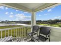 Balcony with two chairs and stunning water views at 9400 Shore Dr. # 309, Myrtle Beach, SC 29572