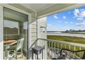 View from balcony showcasing ocean, marsh and seating area at 9400 Shore Dr. # 309, Myrtle Beach, SC 29572