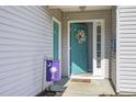 Welcoming entryway with a bright blue door, decorative wreath, and a cheerful 'Welcome' mat at 1130 Ganton Way, Myrtle Beach, SC 29588