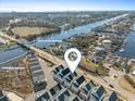 Aerial view of a waterfront community with boat docks and easy access to the Intracoastal Waterway at 129 Marblehead Dr., Little River, SC 29566