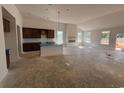 Spacious open-concept living space with a fireplace and large windows at 148 Joyce Dr, Longs, SC 29568