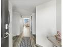 Bright entryway featuring tile floors and a glimpse of the living room with ocean views at 1990 N Waccamaw Dr. # 401, Murrells Inlet, SC 29576