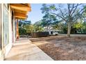 View of the side yard with a concrete walkway next to the unfinished exterior of the house at 204 81St Ave. N, Myrtle Beach, SC 29572