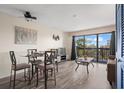 Inviting living area with a glass table, balcony access, modern decor, and neutral color palette, perfect for relaxation at 210 75Th Ave N # 4033, Myrtle Beach, SC 29572