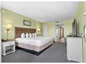 Relaxing bedroom with a king-size bed, soft lighting, and a view of the ocean from the doorway at 2301 S Ocean Blvd. # 825, Myrtle Beach, SC 29577