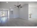 Bright living room with vaulted ceiling, gray floors, open floor plan, and stainless steel appliances at 260 Barclay Dr., Myrtle Beach, SC 29579