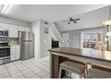 Open floor plan with a kitchen featuring stainless steel appliances and a view into the living room at 416 Cambridge Circle # H5, Murrells Inlet, SC 29576