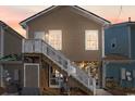 Rear exterior of stilt house with stairs to deck and enclosed storage area below at 4419 Grande Harbour Blvd., Little River, SC 29566