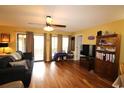 Bright living area with laminate flooring and sliding glass doors at 510 Fairwood Lakes Dr. # 17-C, Myrtle Beach, SC 29588