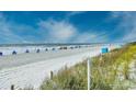 Beautiful beach view with blue skies, ocean waves, and beach chairs, showcasing the proximity to the ocean at 5905 South Kings Hwy. # 4309, Myrtle Beach, SC 29579