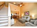 Sun-filled living room with high ceilings, wood floors, and an open staircase at 6244 Catalina Dr. # 4603, North Myrtle Beach, SC 29582