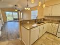 Well-equipped kitchen with granite countertops, modern appliances, and breakfast bar overlooking living area at 635 Waterway Village Blvd. # 12-I, Myrtle Beach, SC 29579