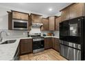Modern kitchen featuring stainless steel appliances, granite countertops, and ample cabinet space at 6614 Torino Lane, Myrtle Beach, SC 29572