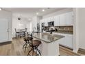 Bright kitchen with granite countertops, stainless steel appliances, and a breakfast bar at 801 San Marco Ct. # C, Myrtle Beach, SC 29579