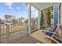 Inviting front porch features seating and neighborhood views at 1188 Peterson St., Myrtle Beach, SC 29577