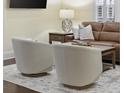 Cozy living room showcasing neutral-toned swivel chairs and a leather sofa at 1188 Peterson St., Myrtle Beach, SC 29577
