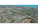 An aerial view of a neighborhood near the beach, surrounded by lush greenery and a glimpse of the ocean skyline at 1335 Wading Bird Ln., Myrtle Beach, SC 29577