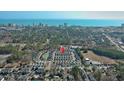 Overhead shot captures a vibrant coastal community with ocean view and proximity to various local amenities at 1335 Wading Bird Ln., Myrtle Beach, SC 29577