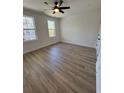 Bright bedroom featuring hardwood floors, neutral walls, and large windows at 1517 James Island Ave., North Myrtle Beach, SC 29582