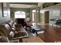 Cozy living room featuring hardwood floors and ample natural light at 153 Highmeadow Ln., Aynor, SC 29511