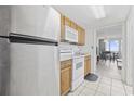 Functional kitchen includes wood cabinets, white appliances, and a convenient layout at 200 76Th Ave. N # 510, Myrtle Beach, SC 29572
