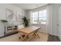 Bright office space with natural light, a wood desk, and stylish decor at 210 Bald Cypress Way, Conway, SC 29527