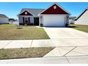 Inviting one-story home with a well-kept lawn, two-car garage, and appealing exterior color scheme at 3461 Holly Loop, Conway, SC 29527