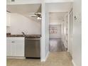 Open kitchen with stainless steel dishwasher and tile flooring adjacent to the living area at 3555 Highway 544 # 17F, Conway, SC 29526