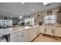 Open-concept kitchen with a breakfast bar and adjacent living area at 3923 Gladiola Ct. # 204, Myrtle Beach, SC 29588