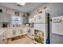 Efficient kitchen with white cabinets, modern appliances, and a window above the sink at 3923 Gladiola Ct. # 204, Myrtle Beach, SC 29588