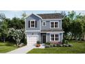 Charming two-story home with blue siding, black shutters and manicured front yard at 455 Falling Leaf Loop, Myrtle Beach, SC 29588