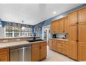 Open kitchen with modern stainless steel appliances, light wood cabinets, and granite countertops at 470 Springlake Dr., Myrtle Beach, SC 29579