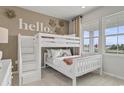 Cozy bedroom featuring a cute bunk bed, playful decor, and bright natural light at 5012 Neverland Ct, Myrtle Beach, SC 29588