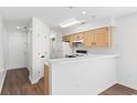 Functional kitchen with light wood cabinets and standard appliances at 537 White River Dr. # 17D, Myrtle Beach, SC 29578