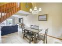 Cozy living area with dining table and chairs, a stairway, comfortable seating, and access to the balcony at 5507 N Ocean Blvd. # 304, Myrtle Beach, SC 29577