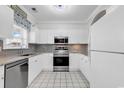 Bright kitchen with stainless steel appliances, granite countertops, and white cabinets at 5750 Oyster Catcher Dr. # 533, North Myrtle Beach, SC 29582