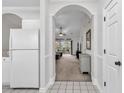 Light, airy living room with doorway to the kitchen and sliding glass door access to the deck at 5750 Oyster Catcher Dr. # 533, North Myrtle Beach, SC 29582