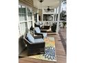 Inviting porch with comfortable seating, a ceiling fan, and stylish decor, perfect for relaxing outdoors at 6001-1383 S Kings Hwy., Myrtle Beach, SC 29575