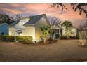 Lovely backyard featuring lush landscaping and a charming, screened-in porch at 6514 Anchors Bend Dr Sw, Ocean Isle Beach, NC 28469
