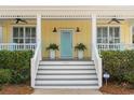 Charming front porch with a pop of color, a relaxing outdoor space at 6514 Anchors Bend Dr Sw, Ocean Isle Beach, NC 28469