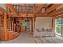 Spacious living room featuring exposed wood beams, a loft, and ample natural light at 906 Plantation Dr., Surfside Beach, SC 29575