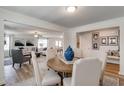 Bright dining area adjacent to living area features a stylish round table with seating for six at 911 Agostino Dr., Myrtle Beach, SC 29579